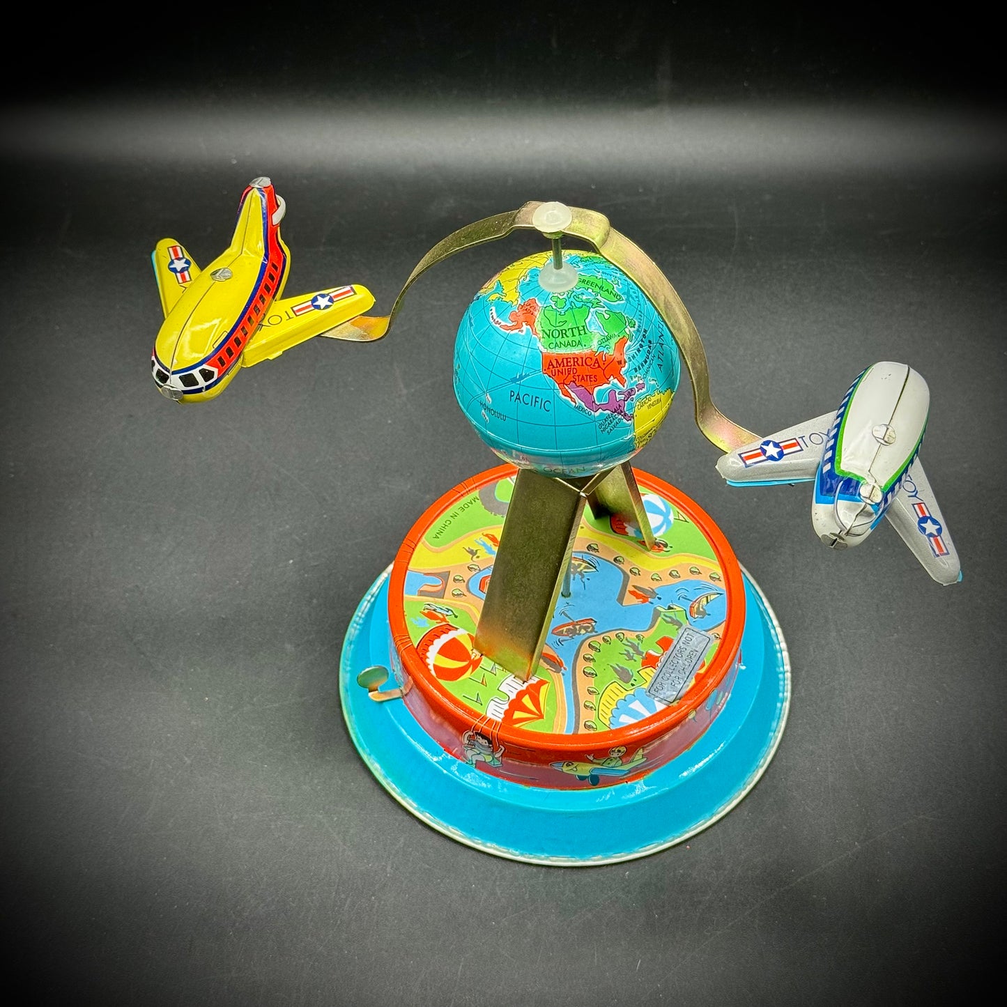 Vintage Wind Up Tin Toy with Jet Age Travel Motif