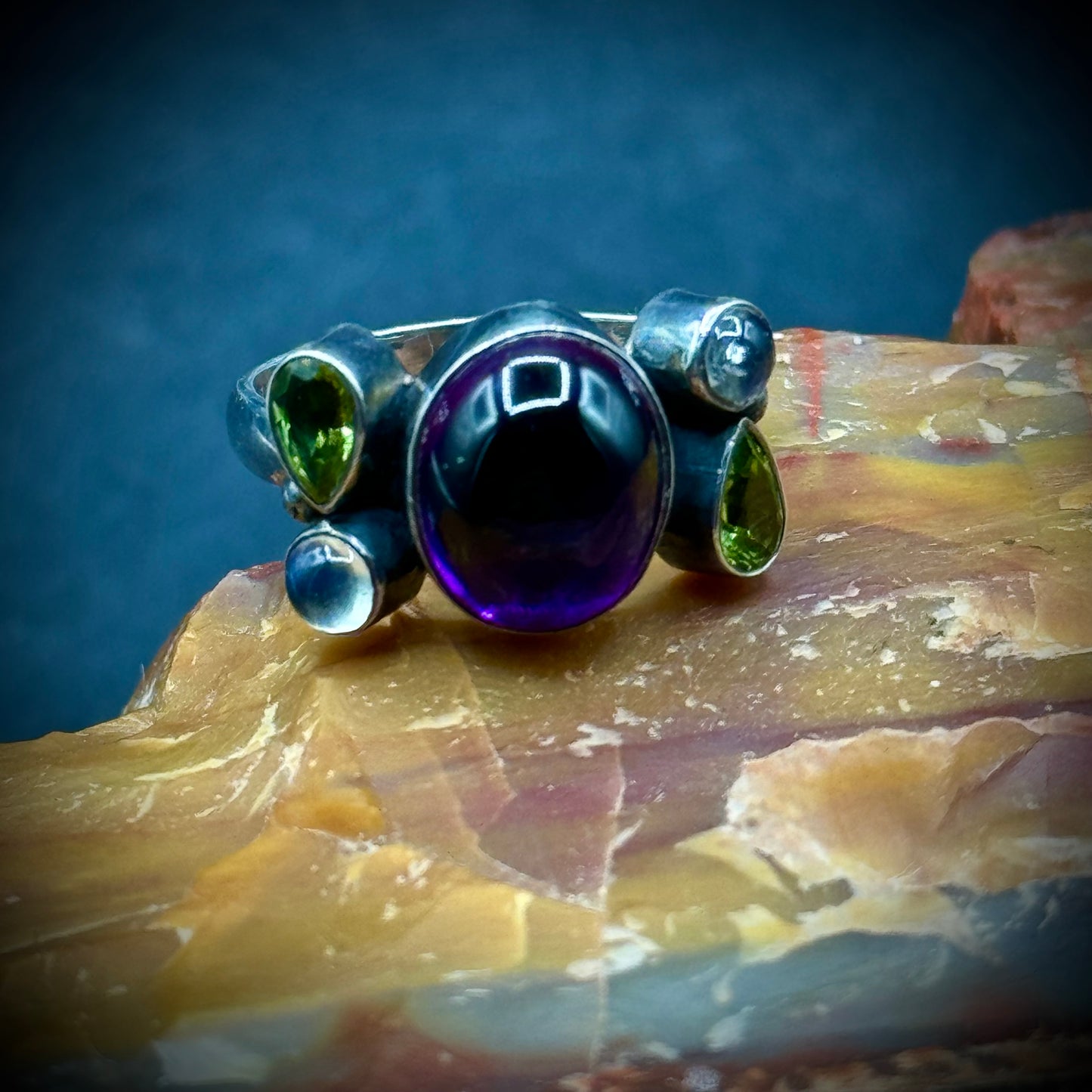 Sterling Silver Ring with Cabochon Amethyst Accented with Moonstones & Peridots